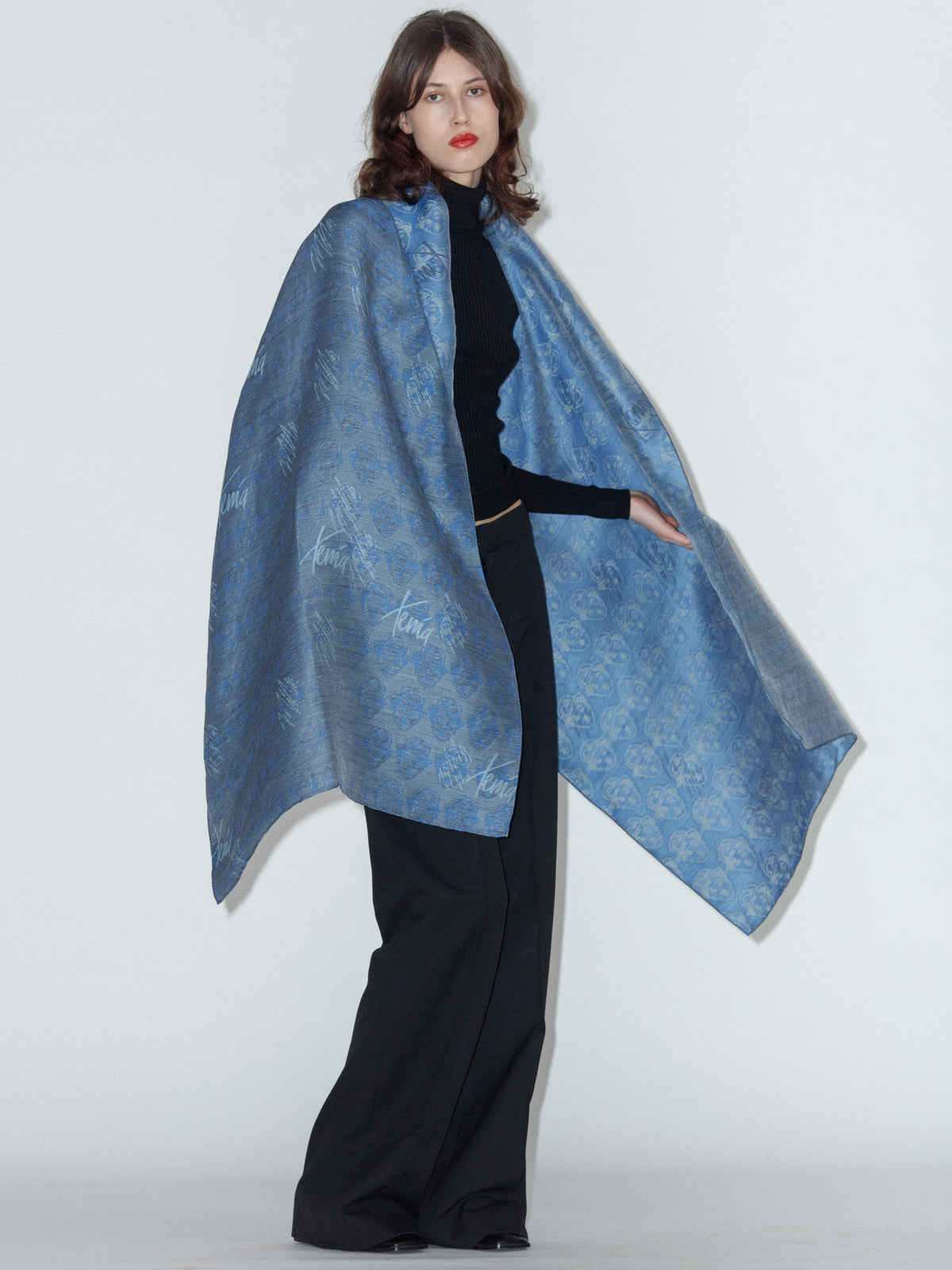 CHARLIE wool and silk scarf in navy, showing the reversible jacquard pattern
