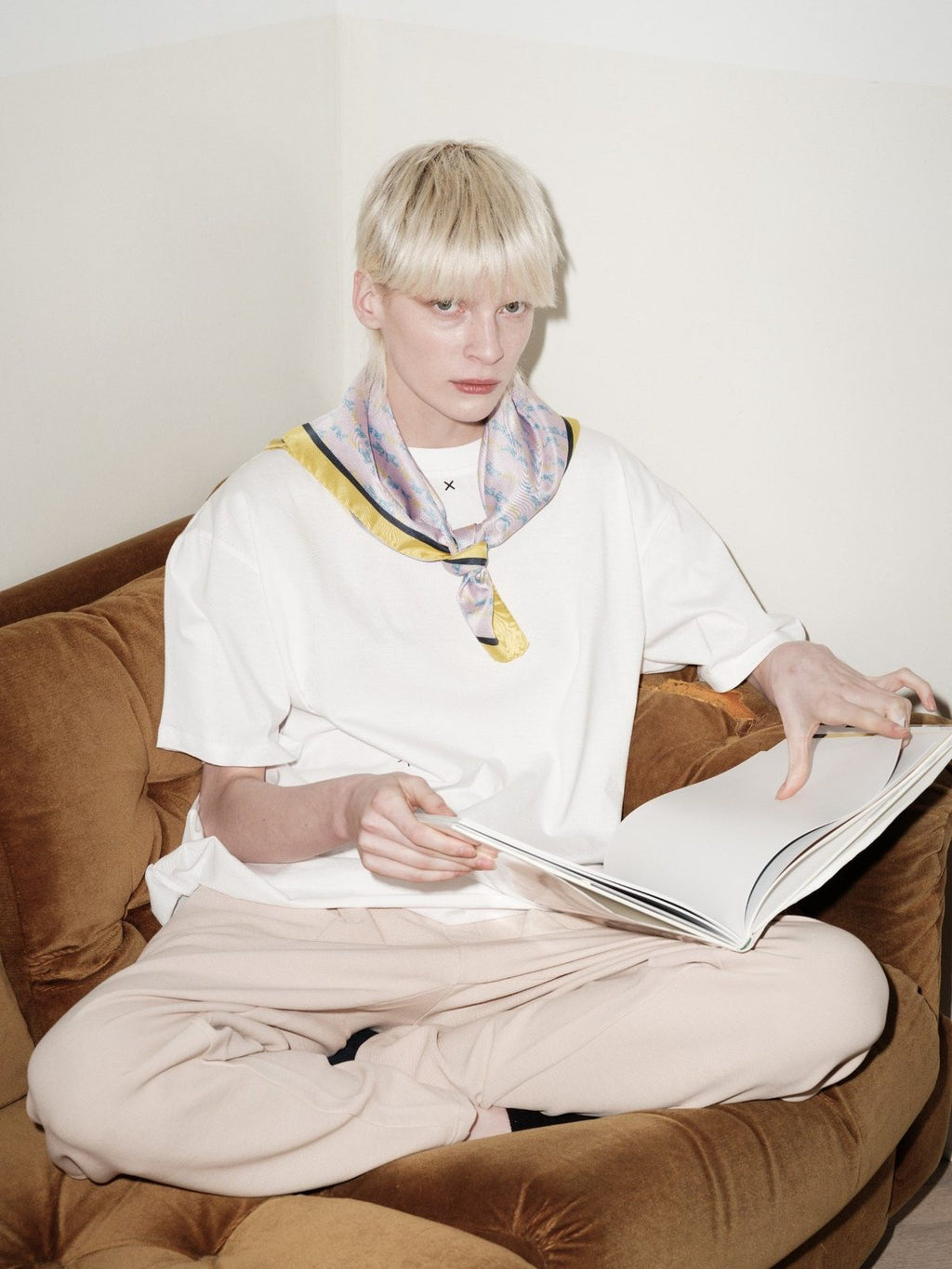 FLY HIGH silk scarf by Xenia Joost worn around the neck