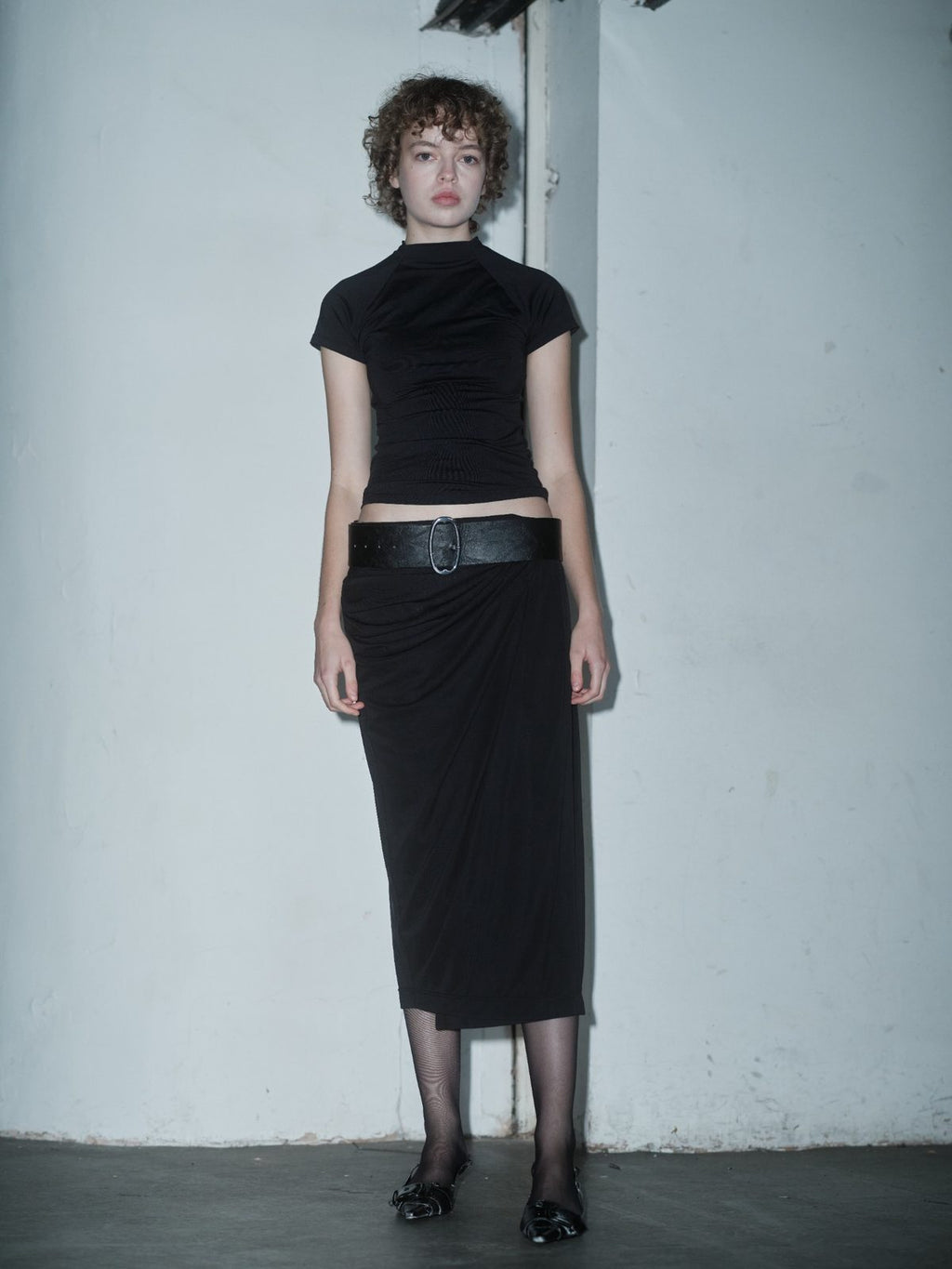 MUSTIQUE draped black skirt by Xenia Joost, front view