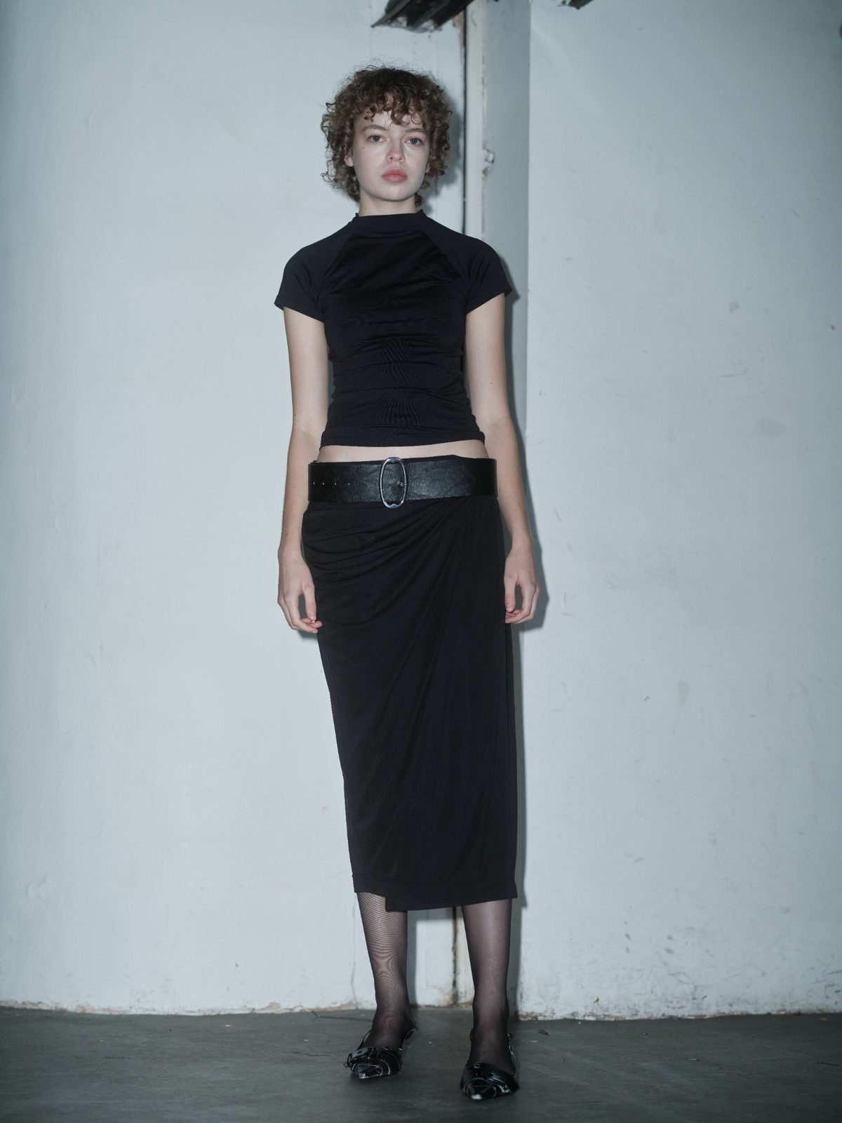 MUSTIQUE draped black skirt by Xenia Joost, front view