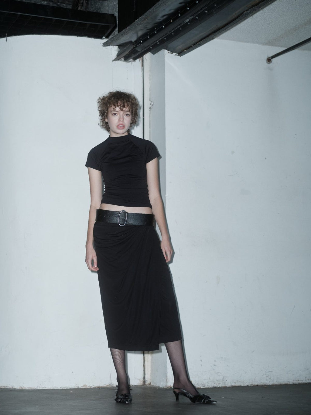 MUSTIQUE draped black skirt by Xenia Joost, full-length styled view