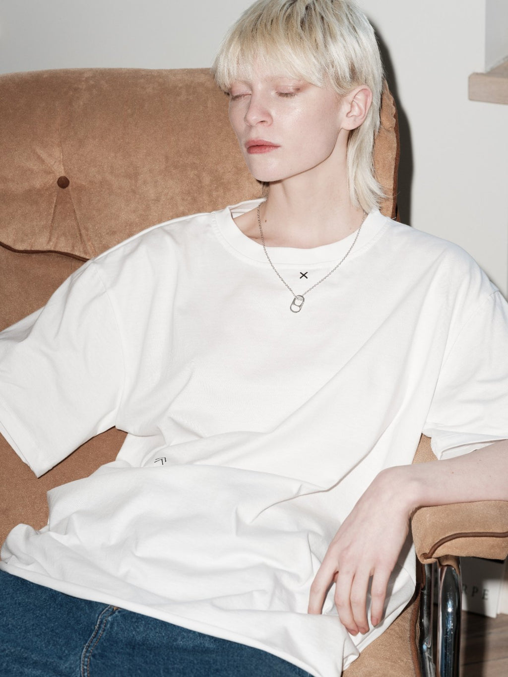 OPEN ME necklace by Xenia Joost worn in seated editorial