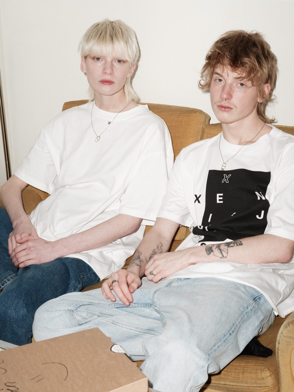 OUTSIDE OF THE BOX unisex T-shirt by Xenia Joost, seated editorial