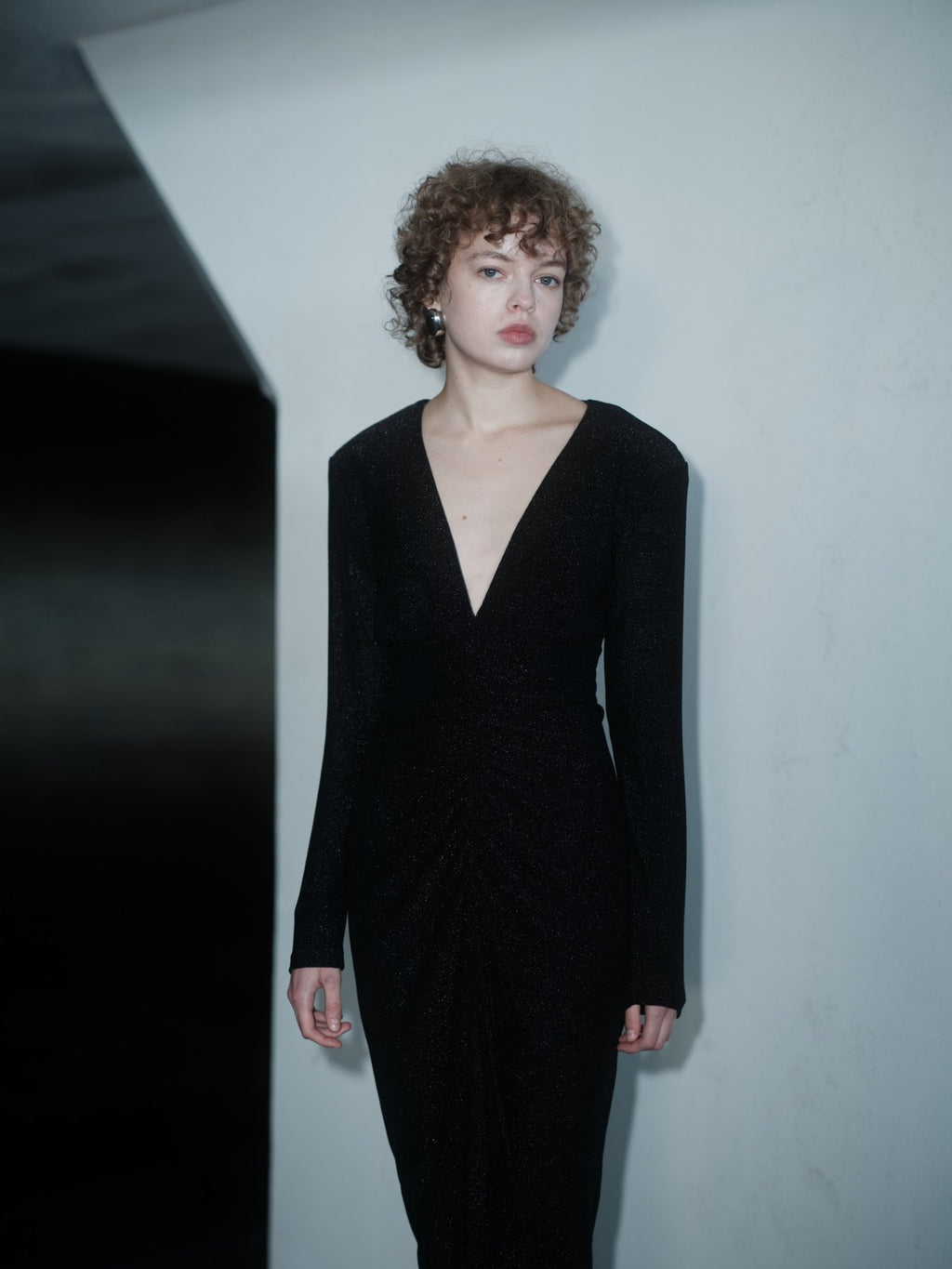 RENDEVOUZ DRESS by Xenia Joost, black shimmering midi dress with deep V-neck and structured shoulders