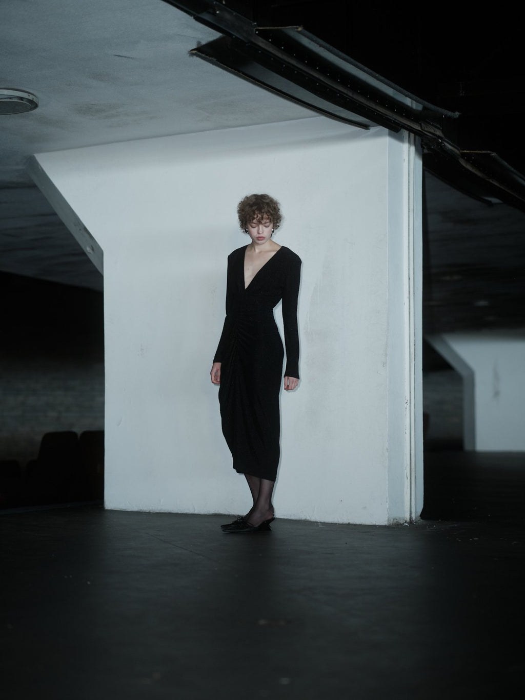 RENDEVOUZ DRESS by Xenia Joost, black fitted midi dress with structured shoulders and draped waist