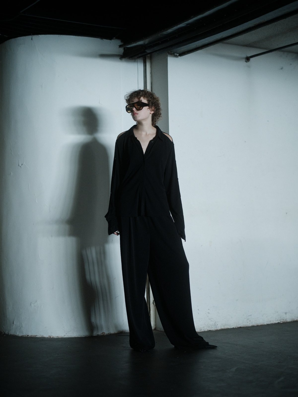 SLEEK VENTURA top in black by Xenia Joost, full-length styled view
