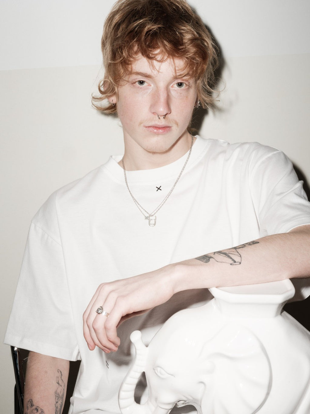 X necklace by Xenia Joost layered with OPEN ME necklace