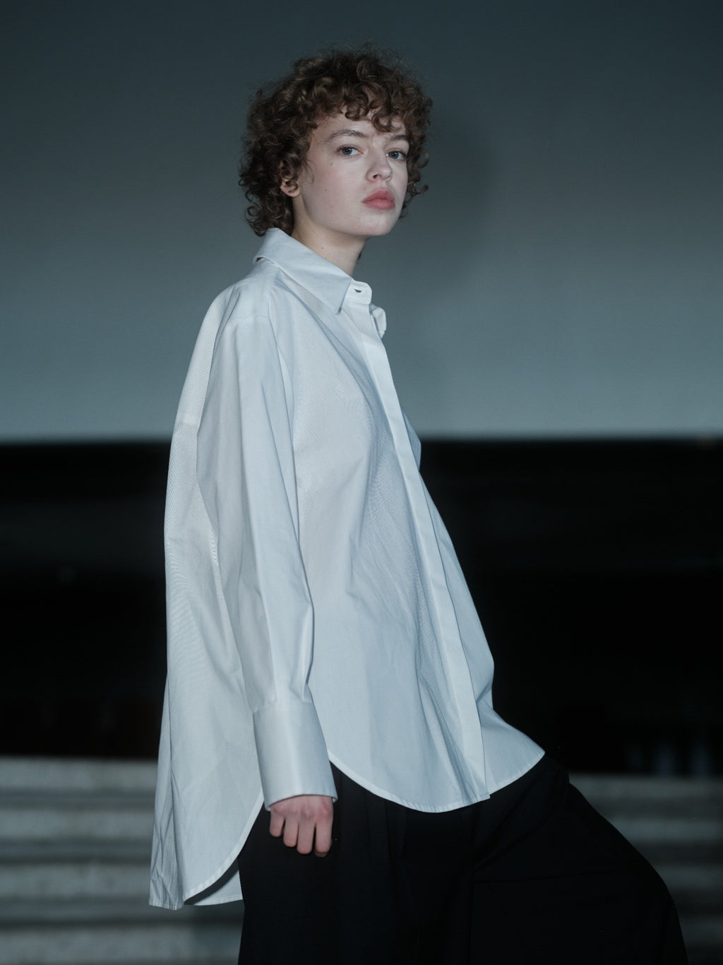Xenia Joost The Statement Shirt — Button Down 001 in white, showing the oversized silhouette and buttoned sleeve construction.