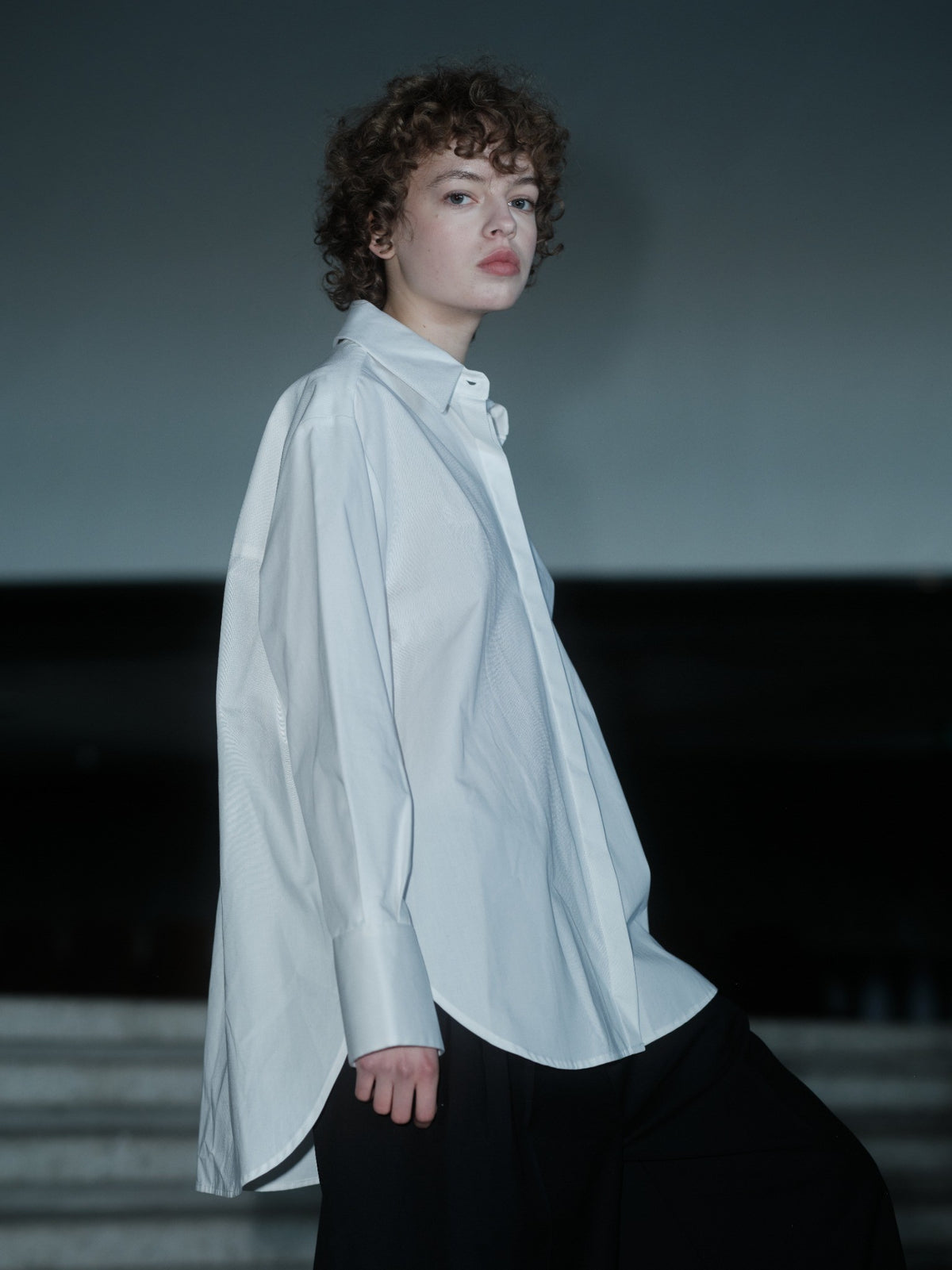 Xenia Joost The Statement Shirt — Button Down 001 in white, showing the oversized silhouette and buttoned sleeve construction.